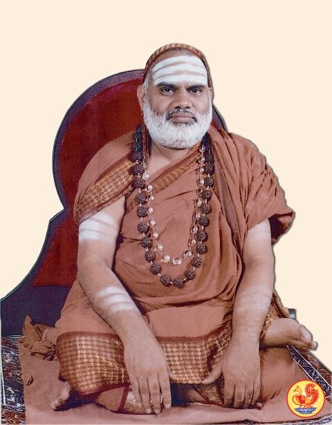 Jagadguru Sri Bharati Tirtha Mahaswamiji seated cross-legged on a high-backed seat against a pale background, with vibhuti on his forehead and arms, rudraksha malas and ochre robes